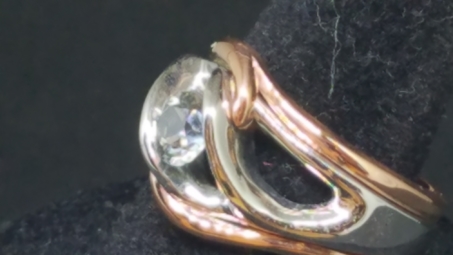 Rose gold outer bands with freeform whte gold center with a clear MT Sapphire 2