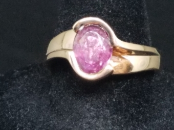 yellow gold ring with oval pink sapphire