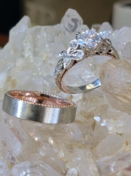 His and hers white and rose gold rings